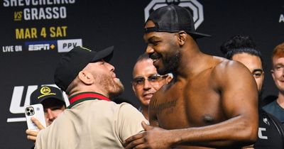 Conor McGregor greets fellow UFC legend Jon Jones before heavyweight title fight