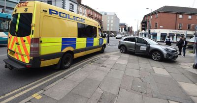 Police called after car crashes into building