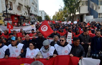 Tunisians protest inflation, president's squeeze on dissent