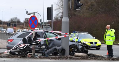 Car flips on roof and traffic lights knocked down after crash on Switch Island
