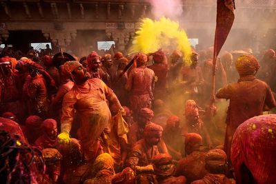 AP Photos: Women with sticks perform Indian festival ritual