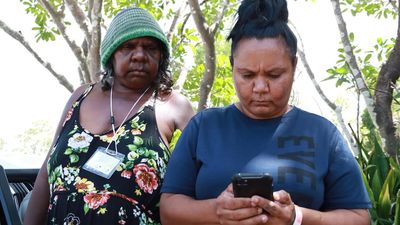 Evacuees wait to return to flood-hit NT remote communities as transport links severed by rising rivers