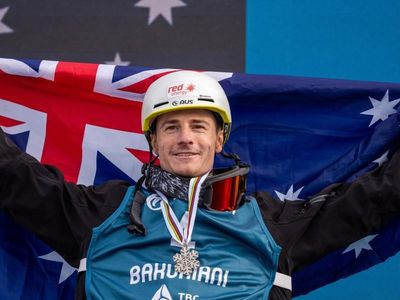 Graham defied broken collarbone to win world ski medals