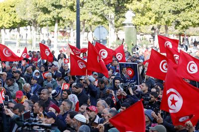 Tunisian opposition defies protest ban, rallies against president