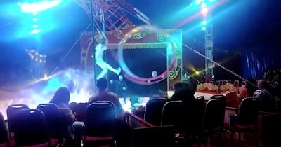 Terrifying moment trapeze artist plunges 30ft to ground in Wheel of Death horror