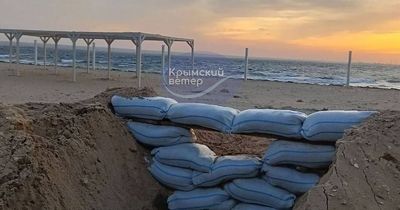 Vladimir Putin builds beach barricades in annexed Crimea over fears of Ukrainian attack