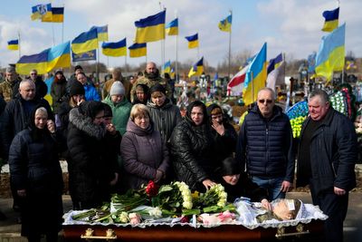 'Oh my daughter': Volunteer medic, 29, buried in Ukraine