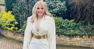 Carol Vorderman rocks 'Elvis look' as she enjoys day out at Sandown Races wowing fans