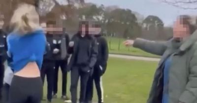 Teen girl booted unconscious outside school as 'woman cheers on attacker'