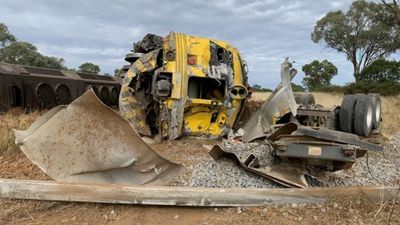Train derails at Old Junee level crossing after collision with a truck, three in hospital