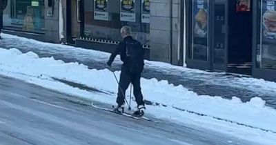 Brits left in tears of laughter at man skiing down road after heavy snow hits country