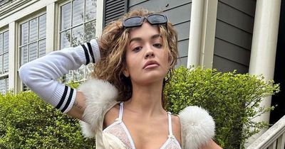 Rita Ora shows off new look as she flashes very taut abs in silk bra