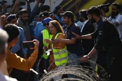 Police try to stop International Women's Day protests in Pakistan. Protesters persist