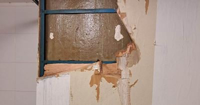 Scots dad 'living in building site' for weeks after ripping out bathroom wall to fix leak