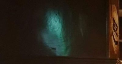 Ghost of 'Green Lady' captured 'smiling' at haunted Glasgow pub in chilling image