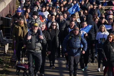 Hundreds join shooting victim’s father for walk against gun and knife crime