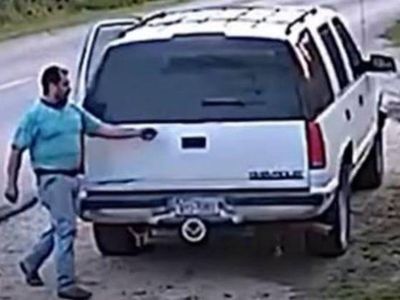 Dallas police hunt man filmed dumping dog on road as traumatised pet chases car