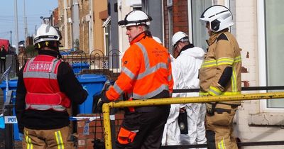 Huge house fire kills woman in early morning blaze with three properties damaged