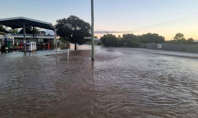 More rain across flooded Queensland region brings ‘extended peak’ – as it happened
