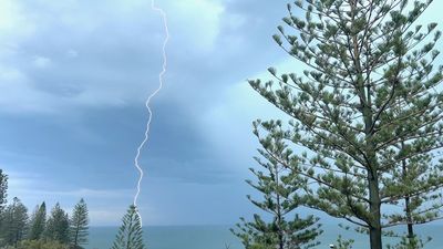 Man taken to hospital after lightning strike as south-east Queensland battered by intense storm