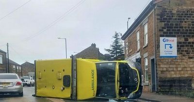 Neighbours heard 'massive bang' after ambulance flipped over in crash that caused 'havoc'