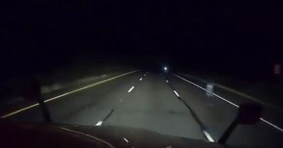 Truck driver captures mysterious ghostly figure standing at side of highway at night