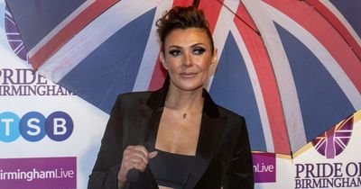 Kym Marsh teases 'best is yet to come' as she poses in sizzling thigh-high split dress