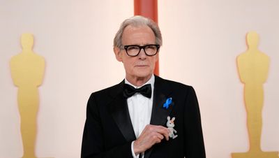 Bill Nighy wears blue ribbon at Oscars in solidarity with displaced people