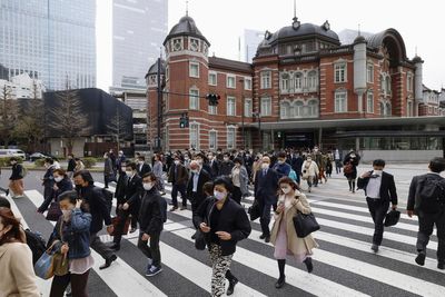 Masks stay put in Japan as 3-year request to wear them ends