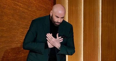 Heartbroken John Travolta breaks down in tears during Memoriam segment at the Oscars