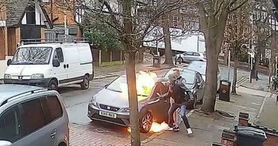Thug pours petrol over car, sets it on fire then punches man trying to stop him in CCTV