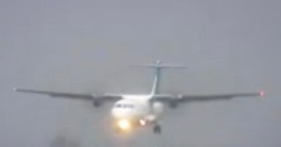 Plane filmed lurching above runway while trying to land as UK battered by 50mph winds
