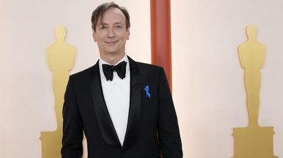 The Meaning behind the Blue Ribbons Worn at the Oscars: Support Refugees