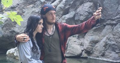 Young couple buried together after being found dead in woodland