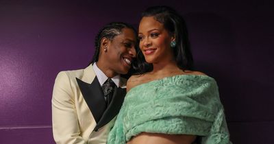 A$AP Rocky sweetly cradles Rihanna's growing baby bump while backstage at the Oscars