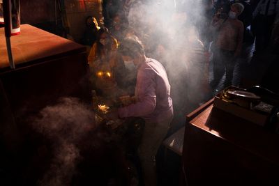 AP PHOTOS: Hong Kong's 'villain hitting' ritual draws crowds