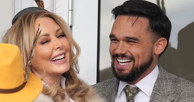 Carol Vorderman and Gareth Gates get VERY cosy at Cheltenham as they join stars in VIP area