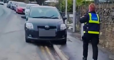 Cold-hearted moment parking officers slap ticket on car left abandoned in blizzard