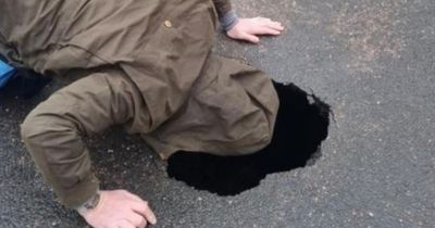 Major 12ft-deep 'sinkhole' suddenly opens up in the middle of busy Isle of Wight street