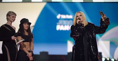 Avril Lavigne tells topless environmentalist to ‘get the f*** off’ stage as she interrupts awards ceremony