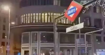 Couple stop traffic after they're spotted getting amorous through hotel window