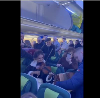 Passengers perform traditional Irish music on flight