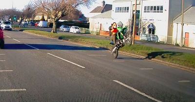Heart-stopping moment Edinburgh dirt bike rider caught pulling wheelie with child