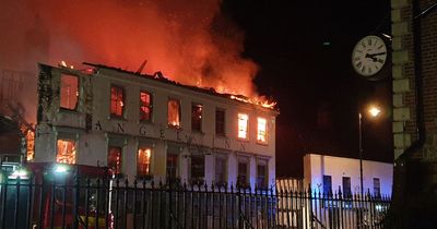 Huge fire tears through 400-year-old hotel 'housing Ukraine refugees' as dozens evacuated