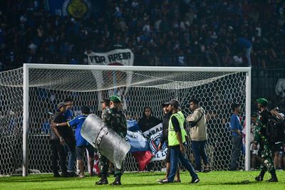 Two freed, one police officer jailed over Indonesia stadium crush