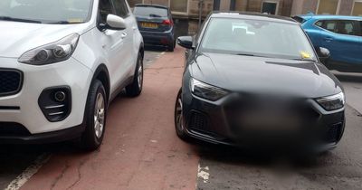 Fuming Glasgow pensioner with 'knee problems' forced to walk on road after cars block hospital footpath