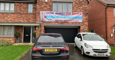 Man puts up massive banner giving scathing review of his £500,000 new-build home