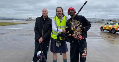 Snoop Dogg welcomed to Scotland in style as piper plays rap classic on tarmac