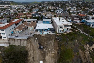 California buildings still in peril from tumbling cliff