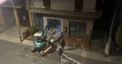 CCTV shows moment brazen thieves use stolen digger to steal entire cash machine